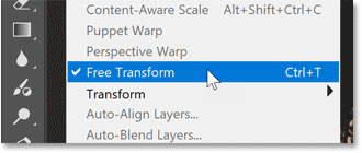 Choosing Free Transform from the Edit menu.